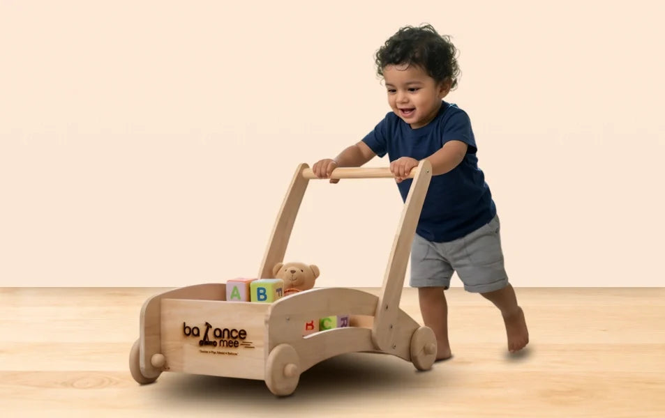Toddler using Balance mee wooden Montessori push toy in cozy nursery with natural decor.