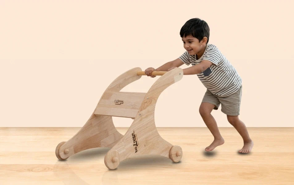 Smiling child pushing handcrafted wooden Montessori balance board toy in cozy playroom