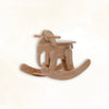 Handcrafted wooden elephant rocking toy, Montessori style, on a light background.