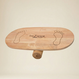 Adult performing core stability exercises on a professional wooden wobble board
