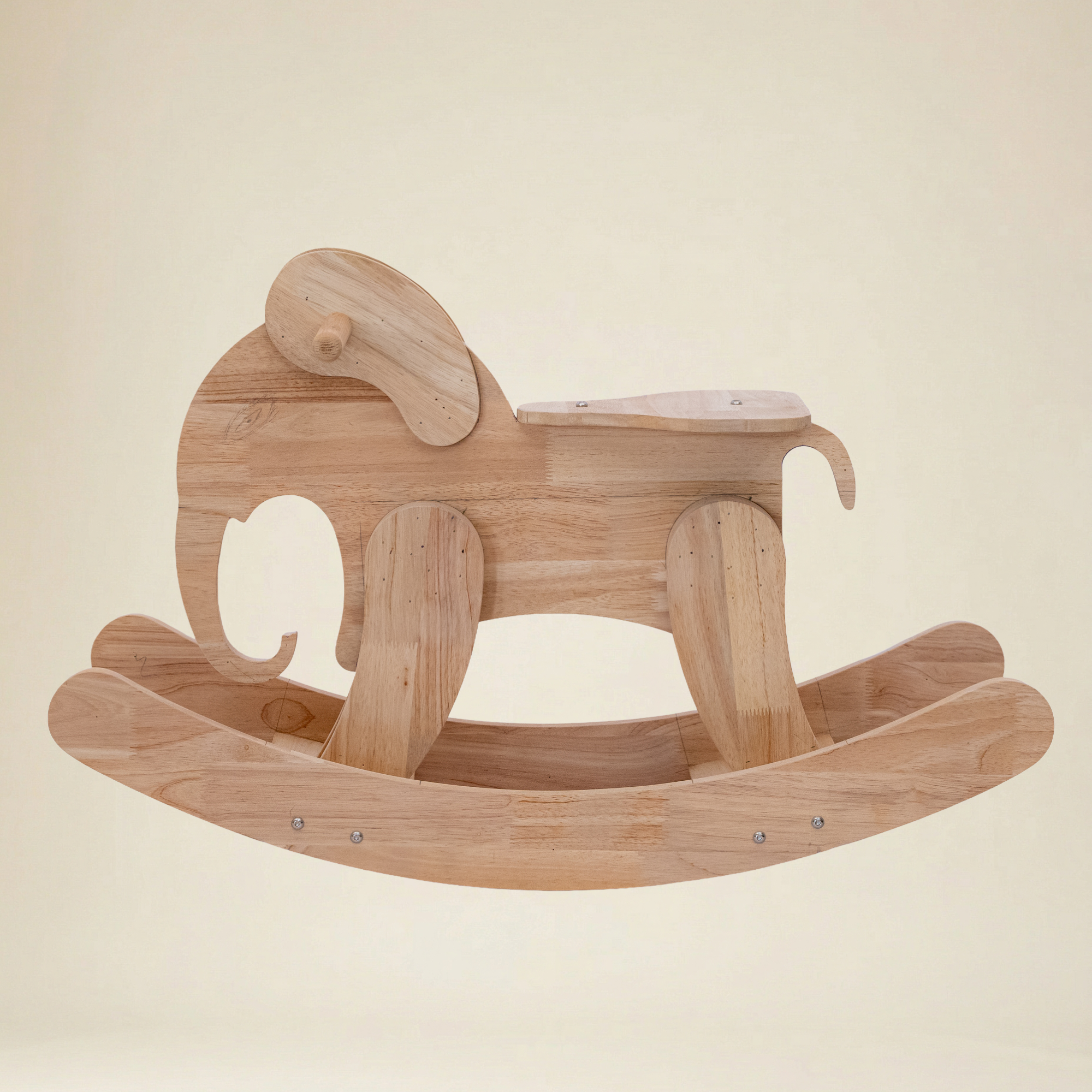 Side view of the elephant-shaped wooden swing showing secure rope attachments