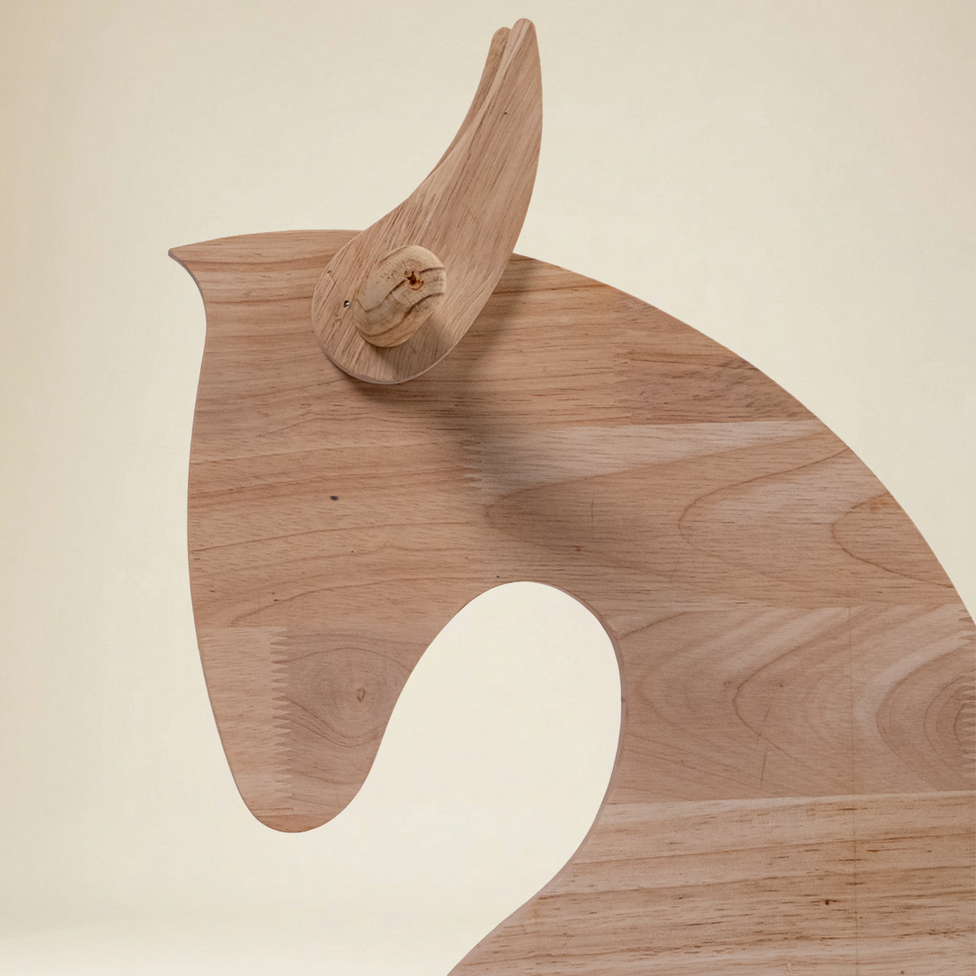 Wooden rocking horse showing ergonomic seat and sturdy wooden base for safe rocking motion
