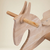 Close-up of wooden rocking horse smooth finish and child-safe rounded edges 