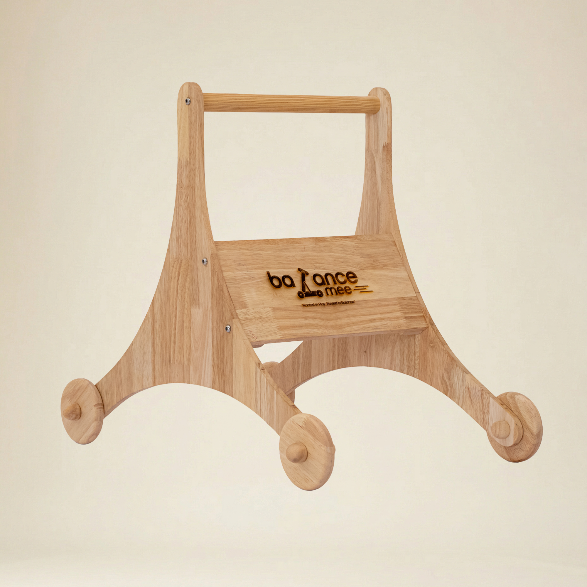 Toddler practicing first steps using a safe wooden star walker