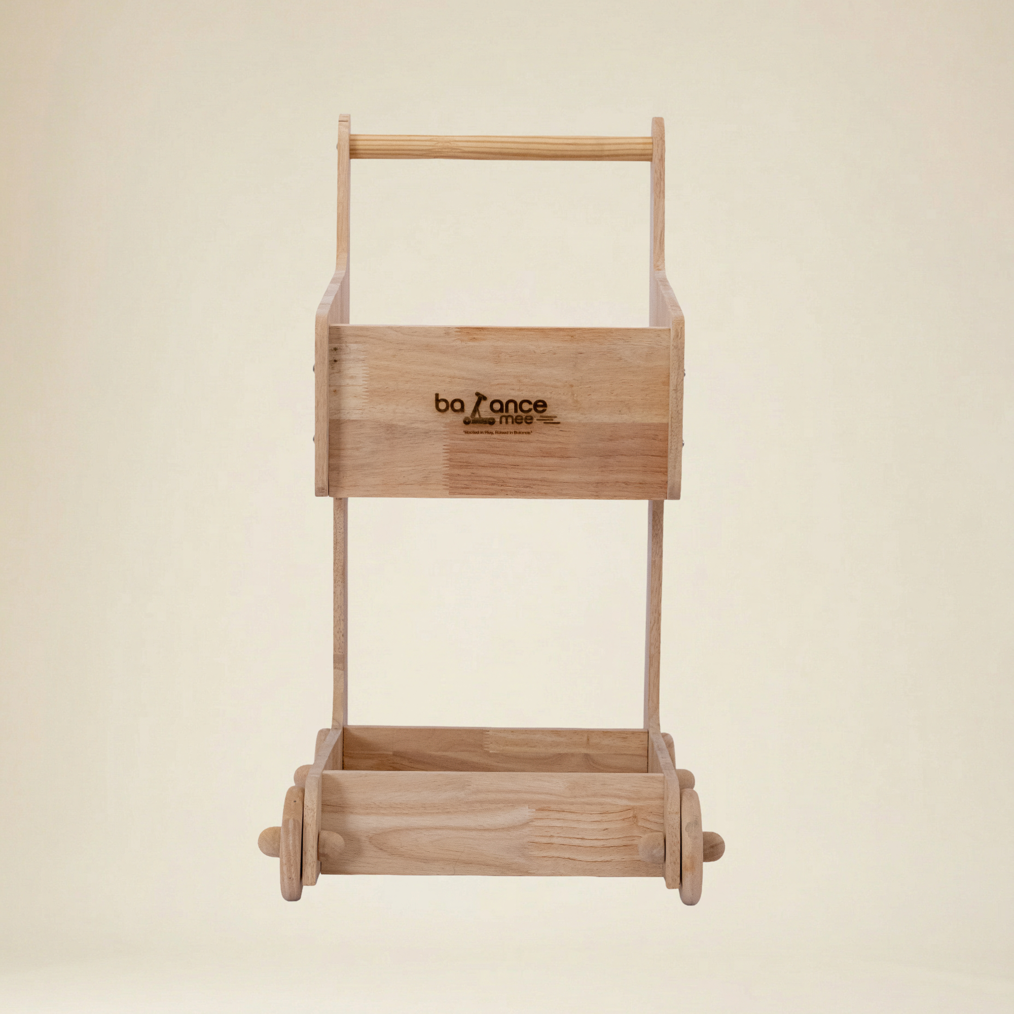 Toddler engaged in Montessori role play with a wooden toy cart
