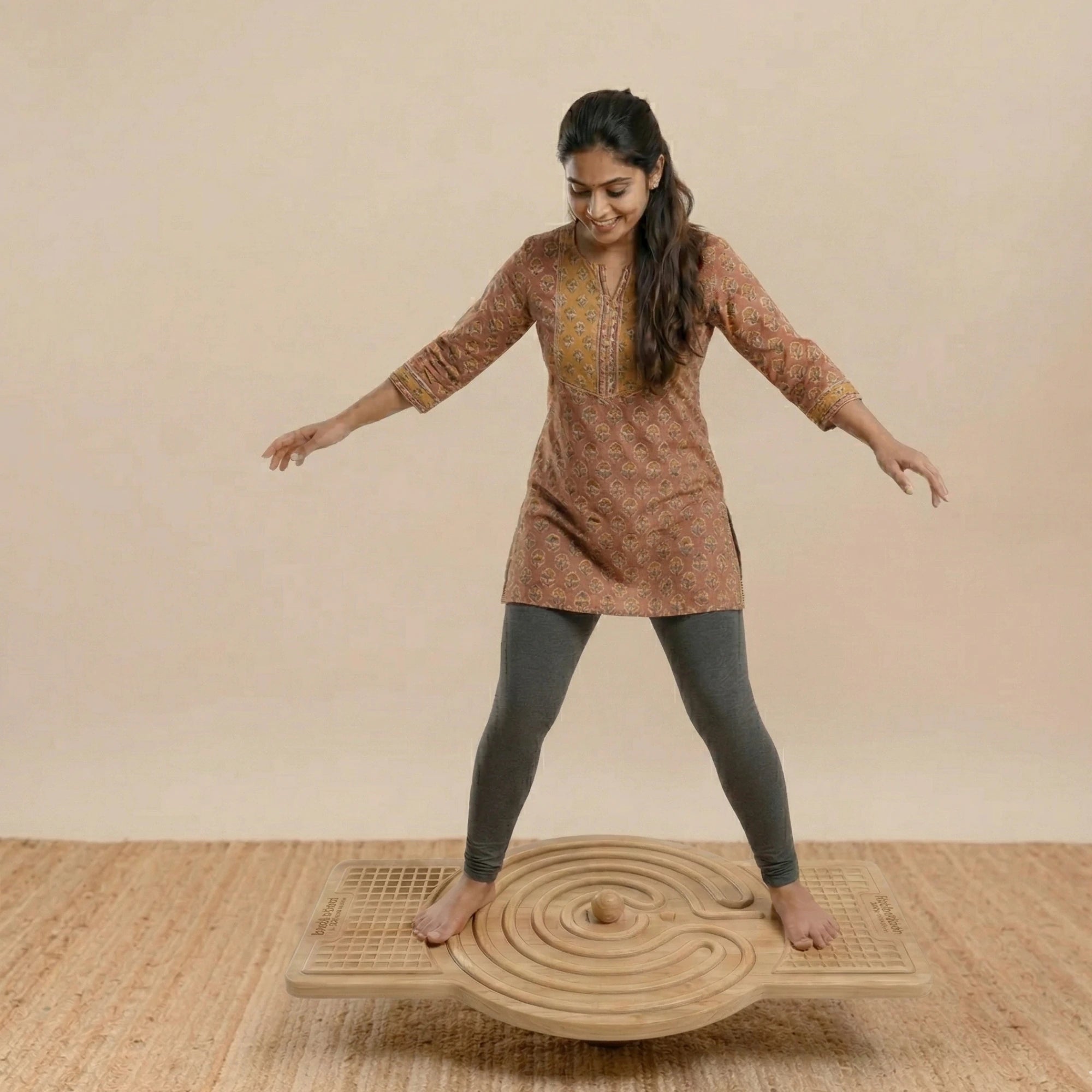 Child performing focus-based exercises on the TASK A wooden balance board