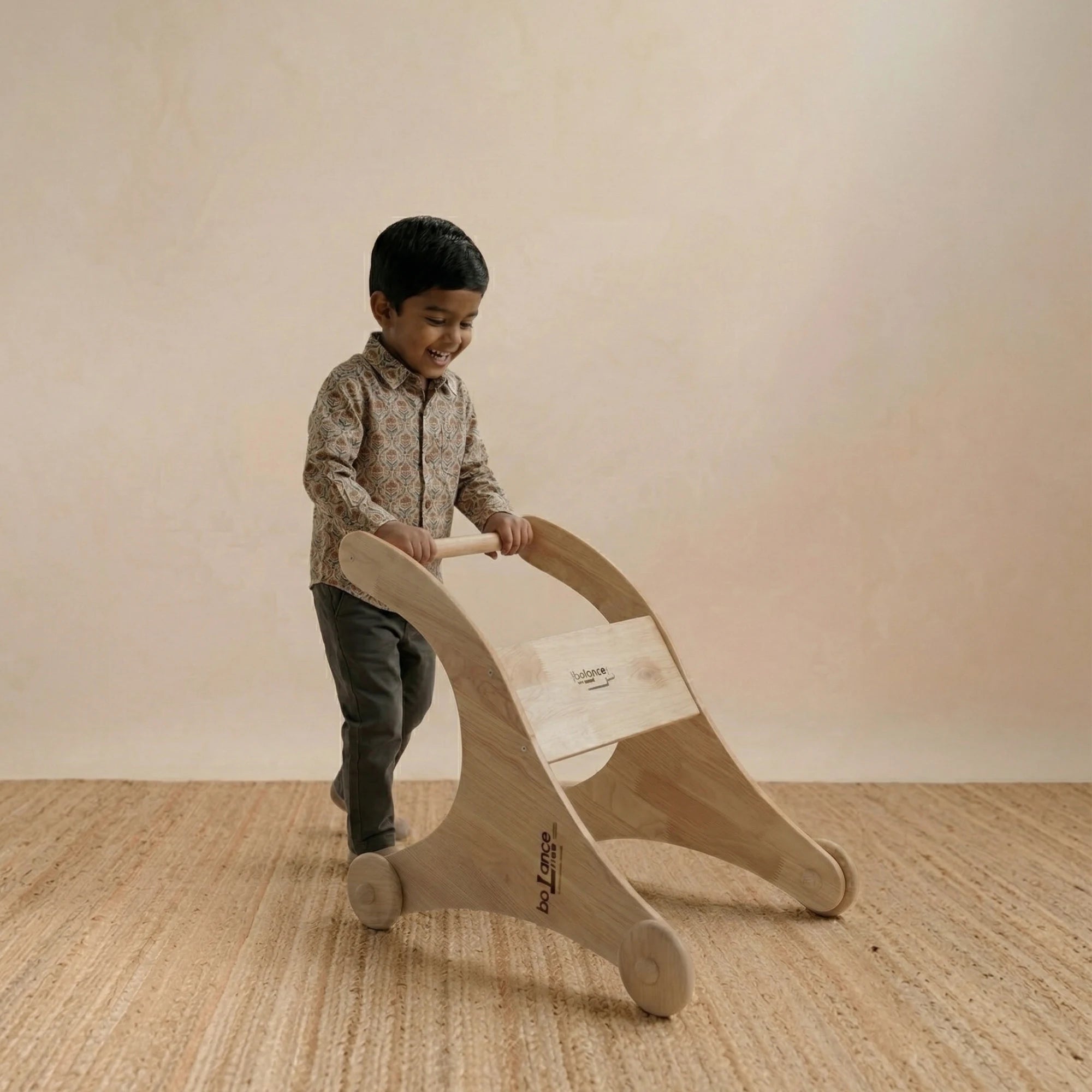 Side view of the shark-themed wooden walker showing sturdy handle